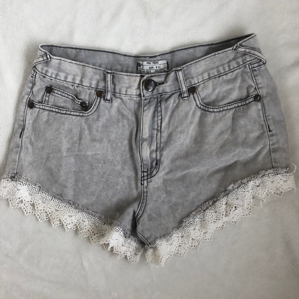 Free people jean shorts with lace trim